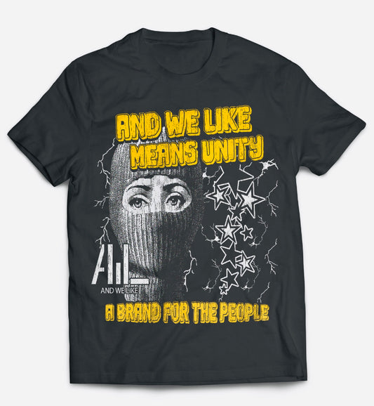 A black T-shirt with a graphic design featuring a person in a ski mask, five stars with lightning bolts, and the phrases "AND WE LIKE MEANS UNITY" and "A BRAND FOR THE PEOPLE" in bold yellow text. The words "AND WE LIKE WE" are also printed in smaller white text.
