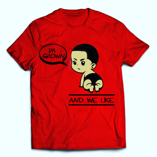 Red T-shirt with an illustration of a crawling baby with short hair. The baby is saying "I'M GROWN" in a speech bubble. Below the baby, the text reads "AND WE LIKE.