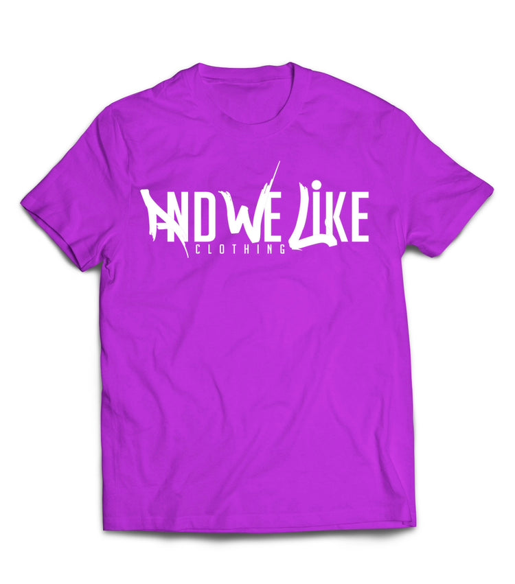 A purple T-shirt with the text "AND WE LIKE CLOTHING" printed in white on the front. The letters "AND WE LIKE" are creatively designed while "CLOTHING" is in a straightforward font below.