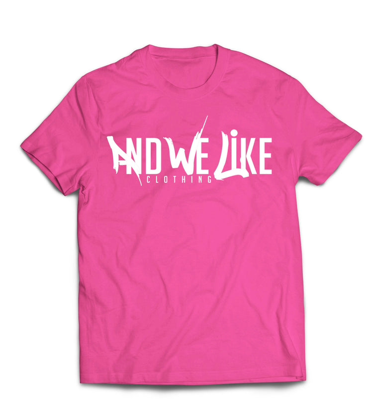 A pink T-shirt with the text "AND WE LIKE CLOTHING" printed in white on the front. The letters "AND WE LIKE" are creatively designed while "CLOTHING" is in a straightforward font below.