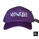 Front facing purple and white  And We Like trucker hat is a classic blend of style and function. The adjustable snapback closure ensures it suits all head sizes. Ideal for a casual, sporty look with its timeless design.